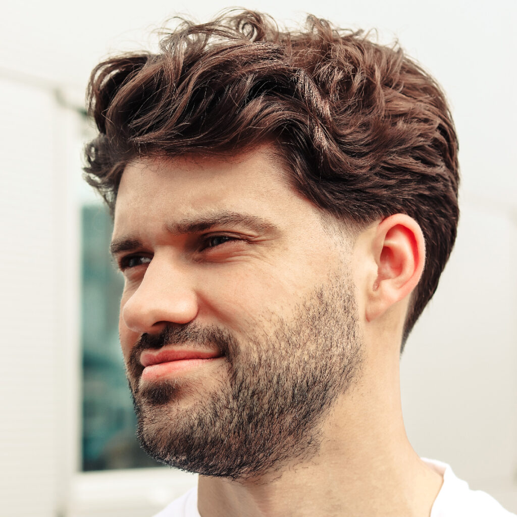 Medium-Length Wavy Hair with Tapered Sides