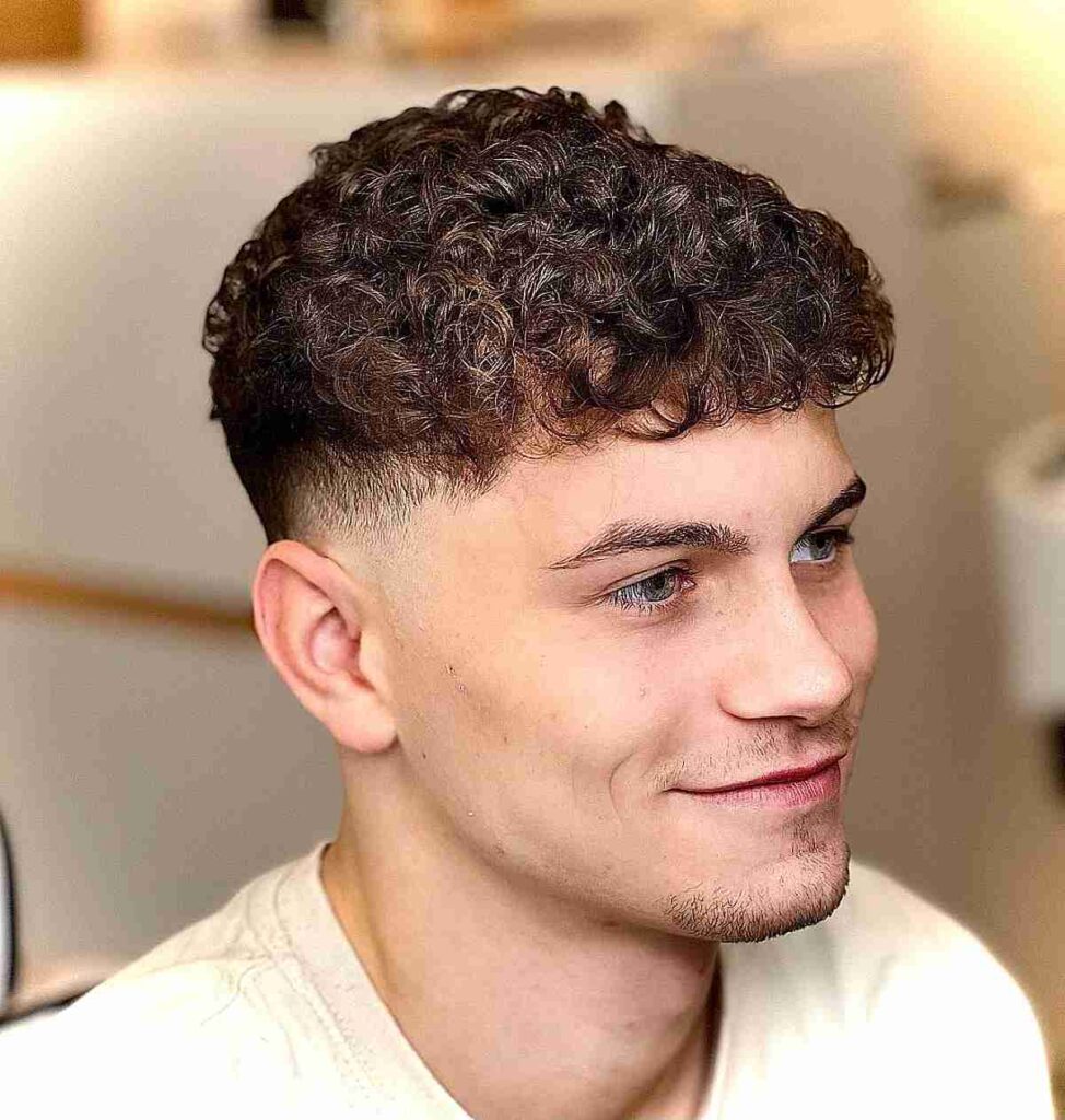 Curly Low Fade with Pompadour