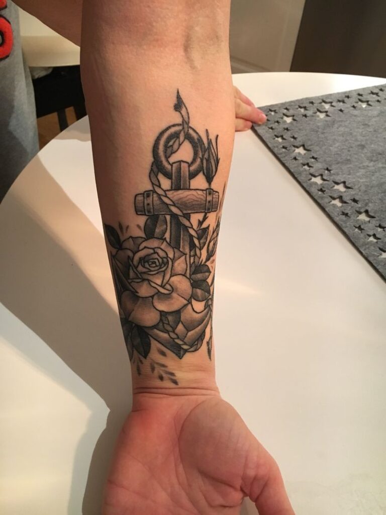 Forearm Rose And Anchor Tattoo